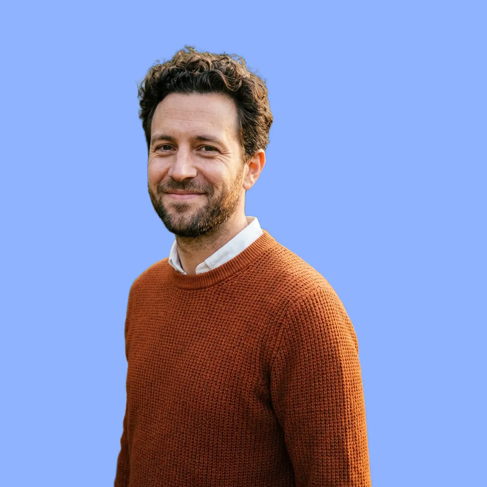 The cut-out portrait of the man on a plain light-blue background