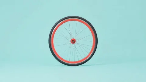 A circular bicycle wheel matches the round compositions of an orange slice and the Moon. Original 8-second rendered example.