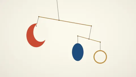A balanced mobile turns with a red crescent, blue oval and gold ring. Original 8-second rendered example.